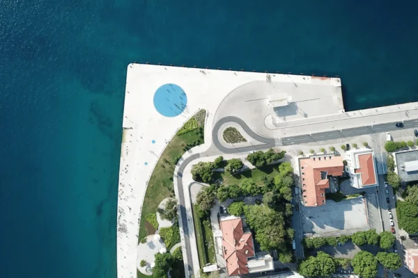 Greeting to the Sun Zadar 22-meter glass circle embedded in waterfront stone pavement during daytime