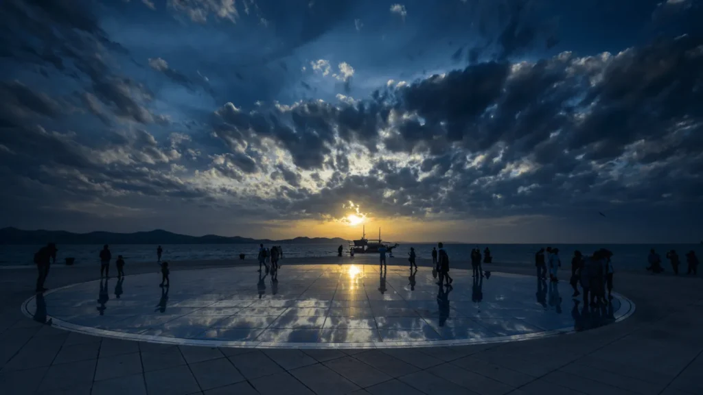 Smaller planet circles around Greeting to the Sun Zadar representing the Solar System