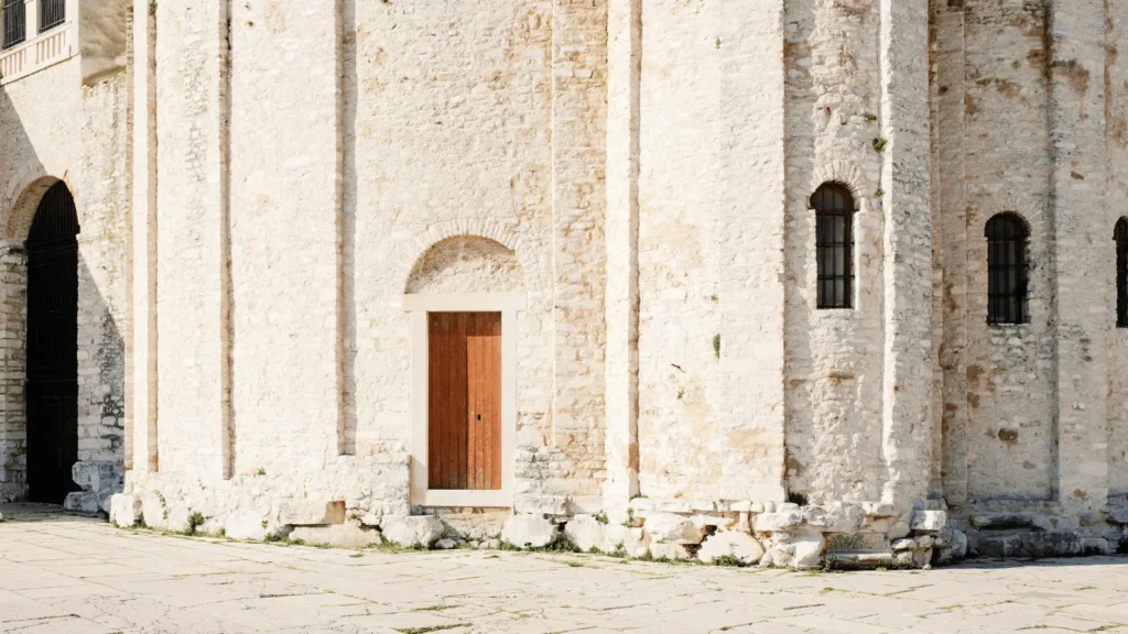 St Donatus Church Zadar exterior photographed from ground level, emphasizing circular stone form and historic character.