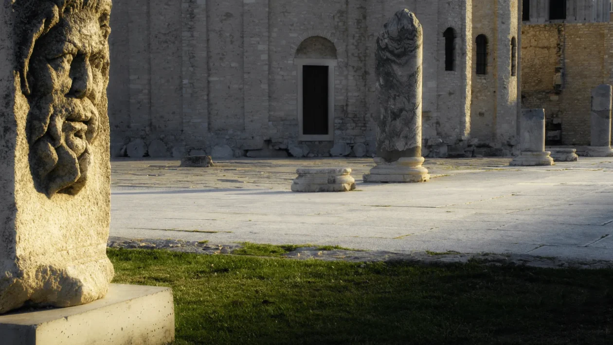 Roman Forum Zadar ruins with standing column and St Donatus Church in background