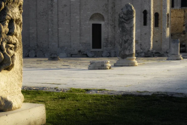 Roman Forum Zadar ruins with standing column and St Donatus Church in background